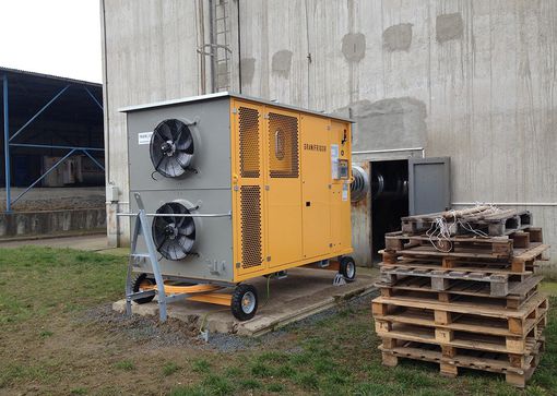 Here, a grain cooling unit is cooling the corn harvest